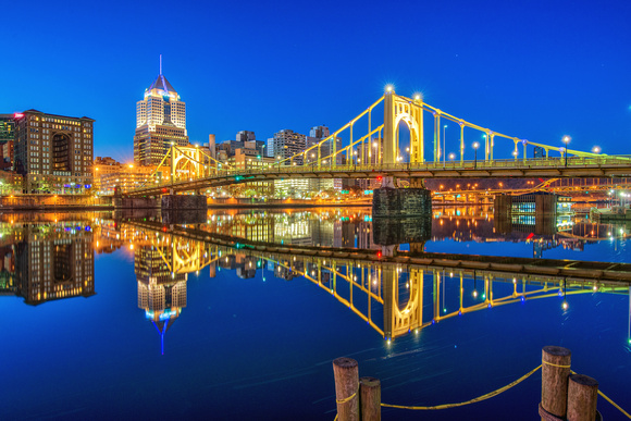 The Roberto Clemente Bridge reflects in the calm waters of the Allegheny River in Pittsburgh HDR