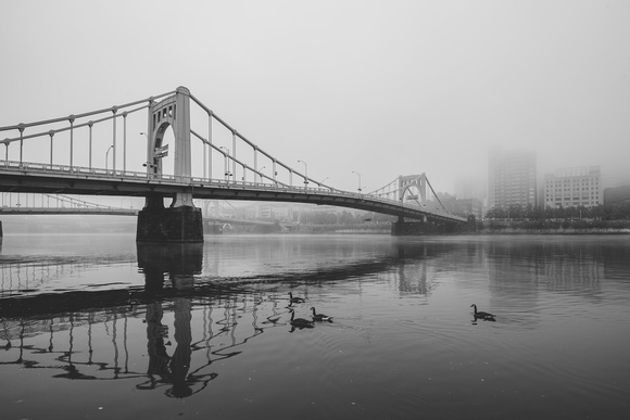 A B&W view of the Andy Warhol Bridge through the fog in Pittsburgh