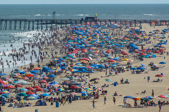 People in Ocean City, MD pack the beaches on a beautiful Saturday