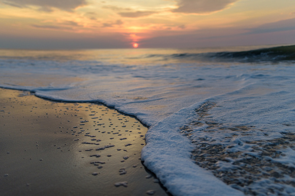 Macro view of the beach in Ocean City, MD at sunrise