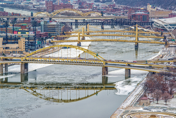 Bridges cross a snow covered Allegheny River in Pittsburgh