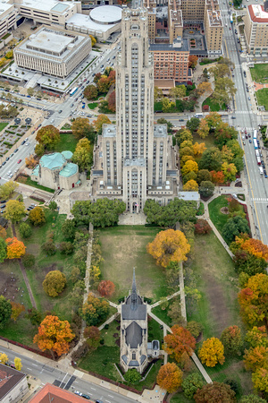A straight on view of the Cathedral of Learning and Heinz Chapel on Pitt's campus in the fall