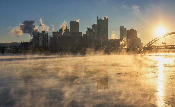 Steam builds on the Ohio River during a frigid Pittsburgh sunrise