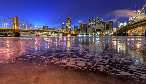 Colorful reflects on the icy Allegheny River in PIttsburgh