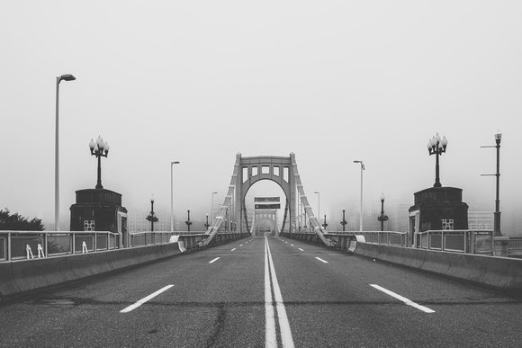 A B&W view of the Roberto Clemente Bridge in the fog in Pittsburgh