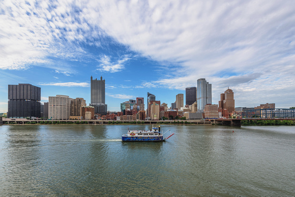 A boat from the Gateway Clipper and the Pittsburgh skyline
