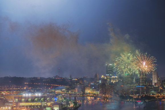 Fireworks and lighting over the Pittsburgh skyline on the 4th of July from the West End Overlook