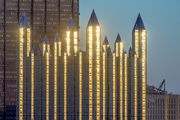 The spires of PPG Place glimmer at dusk in Pittsburgh