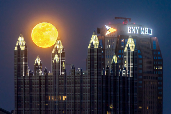 A full moon glows above the spires of PPG Place in Pittsburgh