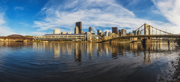 A panorama along the Allegheny River in Pittsburgh at dusk