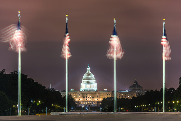 Flags frame the United States Capitol Building in Washington DC