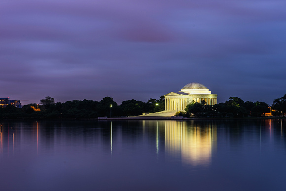 The Jefferson Memorial glows and reflects in the Tidal Basin in Washington DC