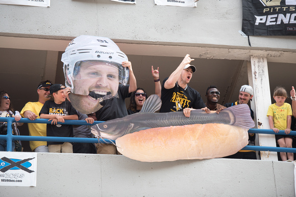 A giant Phil Kessel head and catfish on a hot dog during the Pittsburgh Penguins Victory Parade