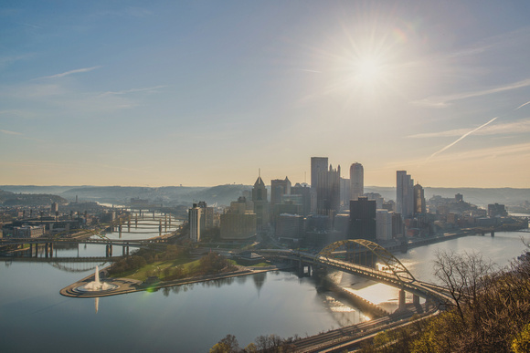Sun shining over the Pittsburgh skyline at dawn