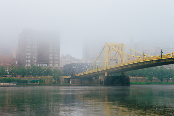 The Renaissance and Roberto Clemente Bridge seen through the fog in Pittsburgh
