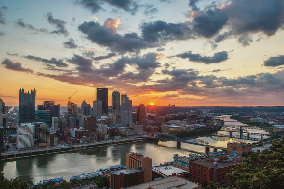 A bright sunrise over Pittsburgh in the summer