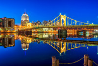 The Roberto Clemente Bridge reflects in the calm waters of the Allegheny River in Pittsburgh HDR