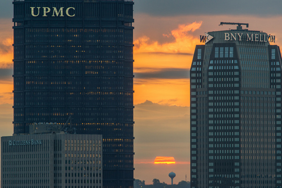 Sun rising between buildings in Pittsburgh