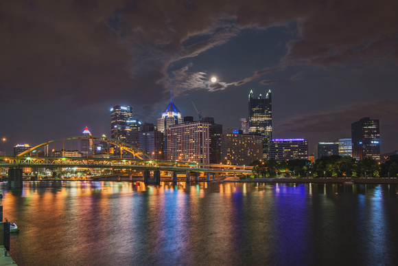 A brightly colored Pittsburgh skyline and Supermoon