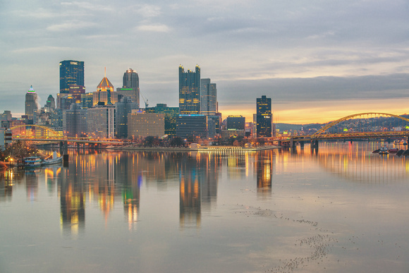 Pittsburgh glows at dawn from the West End Bridge in the winter