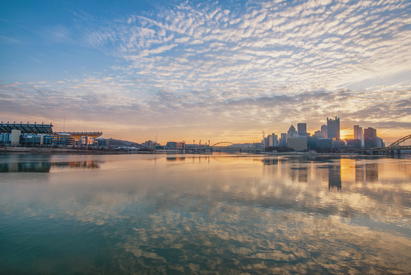 Pittsburgh and Heinz Field reflect in the Ohio River at dawn