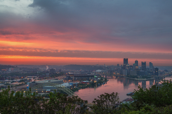 The sky is on fire above Pittsburgh at dawn as seen from the West End Overlook