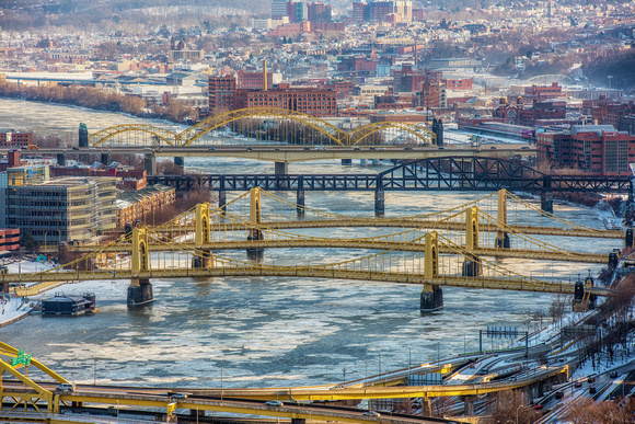 Bridges cross the icy Allegheny River in Pittsburgh