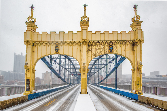 The Smithfield Street Bridge is covered in snow during a storm in Pittsburgh