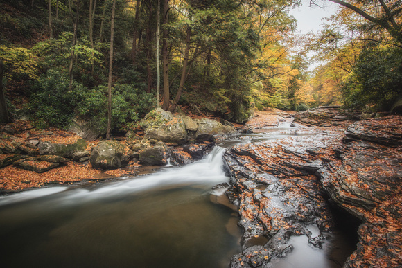 Long exposure of the bottom of the natural rock slides at Ohiopyle State Park in autumn