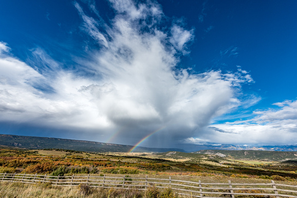 A rainbow appears over Dallas Divide in Colorado