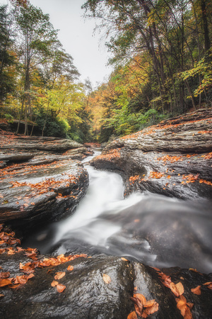 View down the natural rock slides at Ohiopyle State Park in the fall
