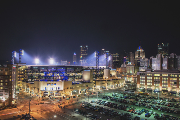 PNC Park under the lights with Pittsburgh in the background