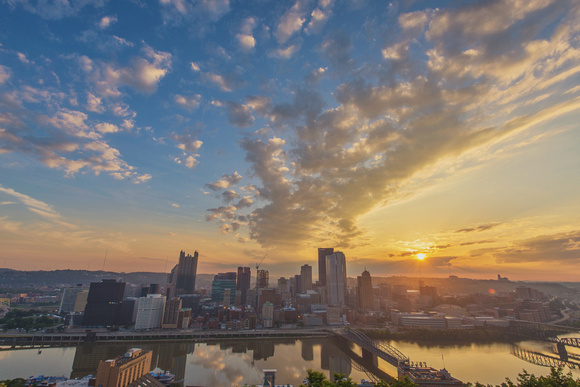Sunrise over Pittsburgh through the clouds from Mt. Washington