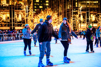 People holding hands on Light Up NIght on the ice rink at PPG Place in Pittsburgh