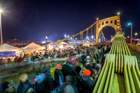 People pack onto the Clemente Bridge in Pittsburgh for Light Up Night