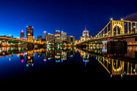 Reflections of the Pittsburgh skyline before sunrise on the North Shore