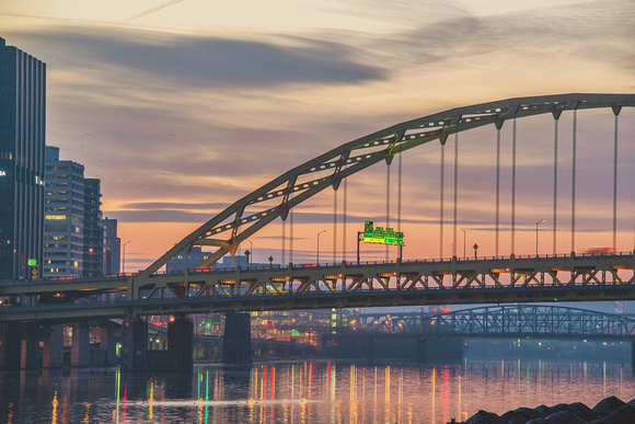 The Ft. Pitt Bridge in Pittsburgh in front of the morning sky