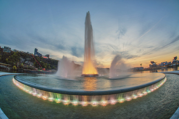 Fountain at Point State Park in Pittsburgh glows against the sunset