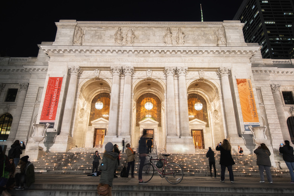 The front of the New York Public Library at night
