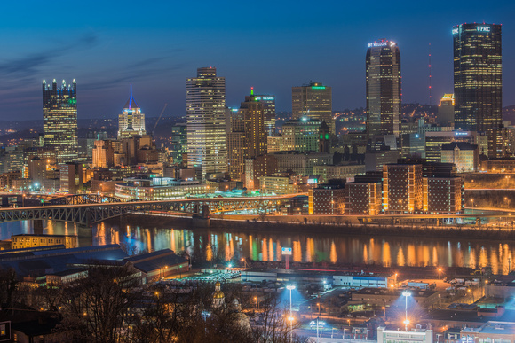 Pittsburgh glows just after dusk from above the South Side