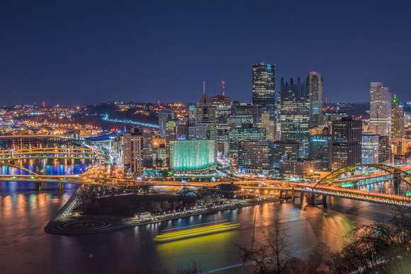 A barge zips passed Pittsburgh during Earth Hour