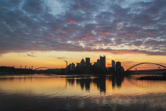 Colorful sunrise over Pittsburgh from the banks of the Ohio River