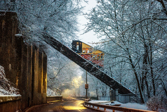 The Mon Incline travels through the snow covered trees in Pittsburgh