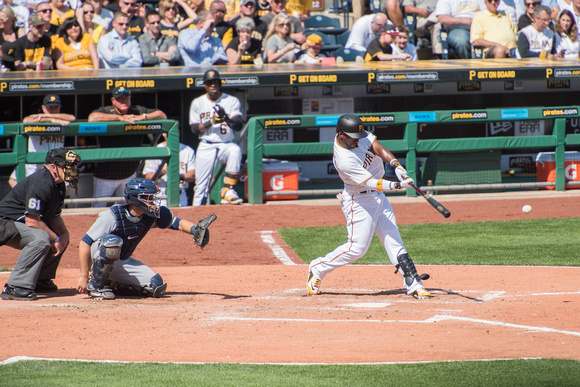 Andrew McCutchen swings at a pitch on Opening Day in Pittsburgh