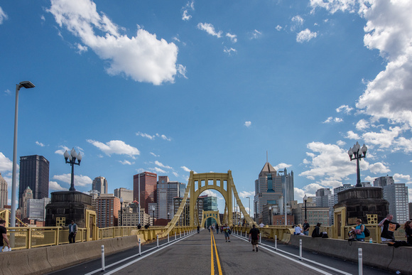 Fans cross the Roberto Clemente Bridge after the Pittsburgh Pirates win on Opening Day