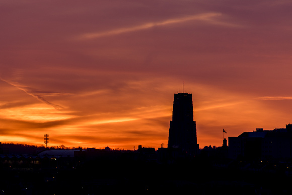 The Cathedral of Learning is silhouetted against a beautiful morning sky