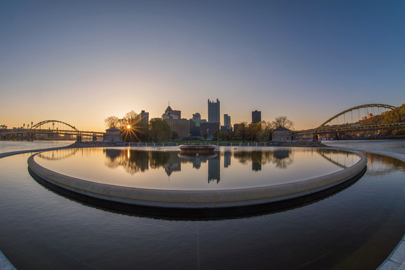 Pittsburgh reflects in the fountain at Point State Park at dawn
