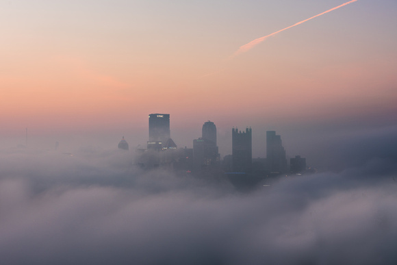 Fog engulfs Pittsburgh making it look like it's floating in the clouds