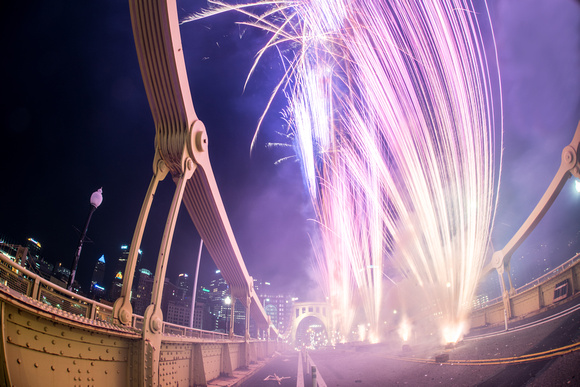 Fireworks explode from the Clemente Bridge in Pittsburgh
