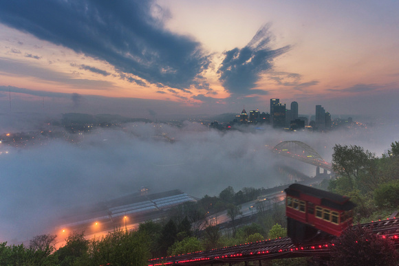 The Duquesne Incline clumbs Mt. Washington on a foggy Pittsburgh morning